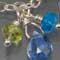Apatite, tanzanite, chrome diopside, tourmaline, blue topaz, kyanite, and silver