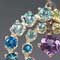 Silver, amethyst, chrome diopside, iolite, blue topaz, apatite, and peridot