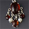 Silver, hessianite (garnet), and pearls