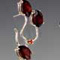 Silver, fire opal, and garnet
